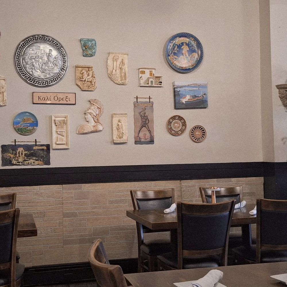 Sparta Taverna - This is the interior of the restaurant, with items and decor pertaining to Greece on that wall - Greek Near Me - Ridgefield Park, New Jersey