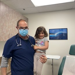 Dr. John and Amélie after she got her lollipops and staple for her cut. Dr. John and Amélie after she got her lollipops and staple for her cut.