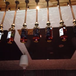 Whiskey bottles hanging from the ceiling