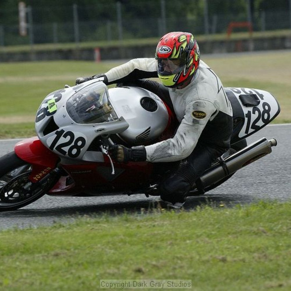 Cougar Store - a man riding a motorcycle on a track - Grocery Near Me - Cougar, Washington