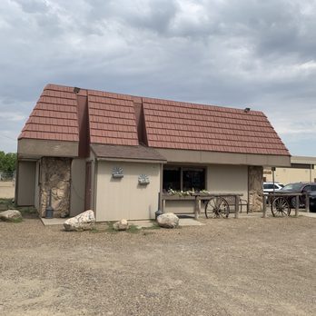 Hitchin'post - a car parked in front of a building - Diners Near Me - Malta, Montana
