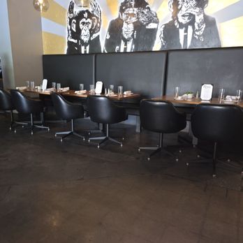 Rebel Kitchen + Bar - Booth seating with respctfu artwork - Bars Near Me - Lombard, Illinois