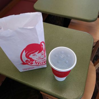 Wendy's - a plastic cup and a paper bag on a table - Burgers Near Me - Macon, Georgia Wendy's - a plastic cup and a paper bag on a table - Burgers Near Me - Macon, Georgia
