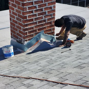 24/7 Roofing Solutions - built a new cricket to reduce chance of leak, this area had issues on my old roof. flashing cut into masonry. - Roofing Near Me - El Monte, California