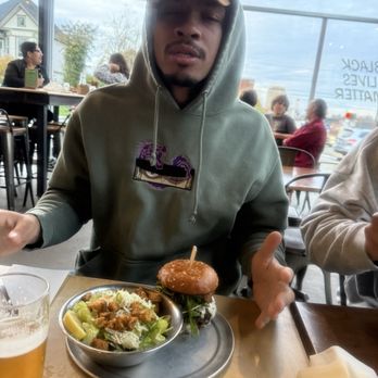 Aslan Brewing Company - Jalel with his Bacon double burger and Cesar salad - Brewpubs Near Me - Bellingham, Washington