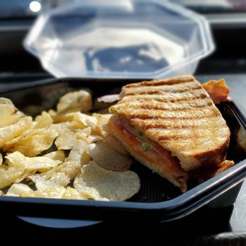 Orange Clover Kitchen & More - a sandwich and potato chips - New American Near Me - Jeffersonville, Indiana