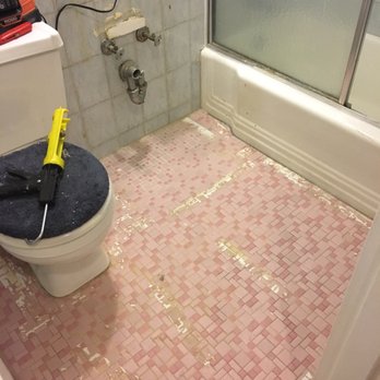 S & S Handyman - BEFORE: The rug had to be removed & the area cleaned. Wanted to cover this awful pink tile. - Handyman Near Me - New York, New York S & S Handyman - BEFORE: The rug had to be removed & the area cleaned. Wanted to cover this awful pink tile. - Handyman Near Me - New York, New York
