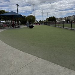 Foster City Dog Park - Very clean and open with tarp and some dirt areas too. Nicely appointed with benches and picnic tables too.