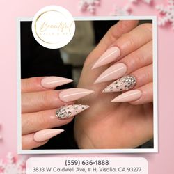 Beautiful Nails & Spa - Elevate your nail game with sharp lines and sparkling stones. This pointed style is all about the details!