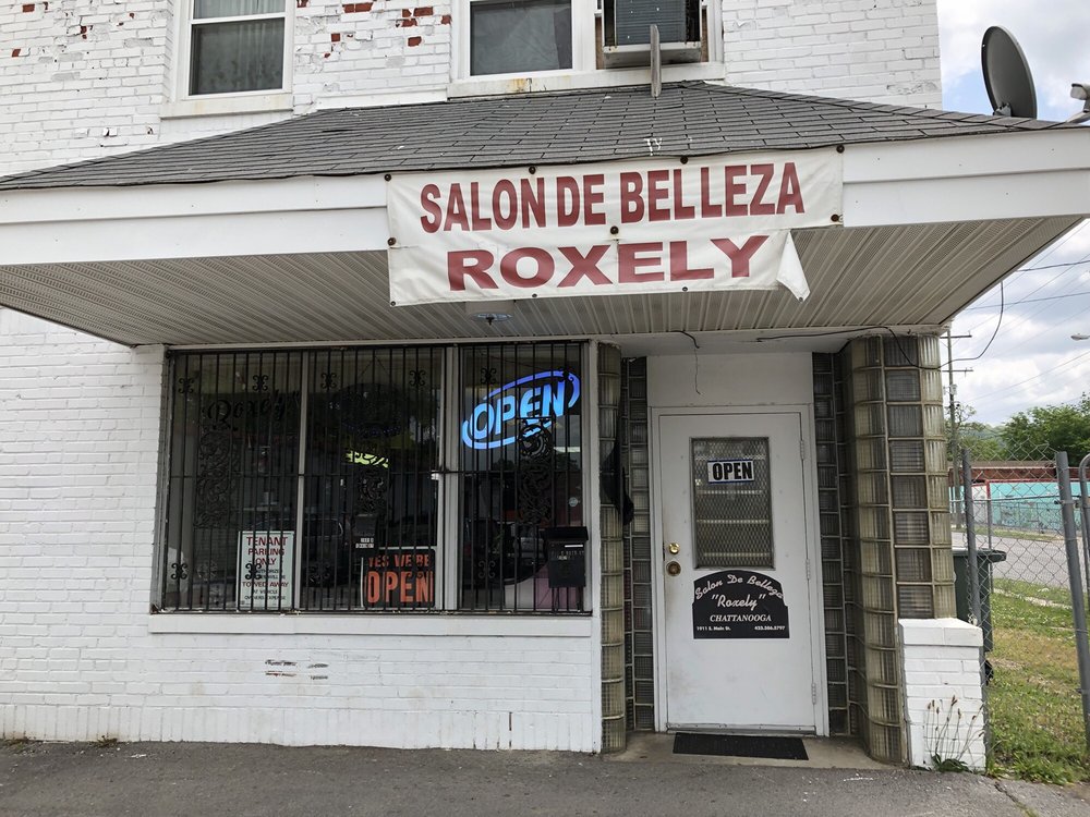 Salon de Belleza Roxely Logo