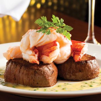 The Capital Grille - Seared Tenderloin with Butter Poached Lobster Tails – the ultimate surf and turf experience. - Steakhouses Near Me - Orlando, Florida The Capital Grille - Seared Tenderloin with Butter Poached Lobster Tails – the ultimate surf and turf experience. - Steakhouses Near Me - Orlando, Florida