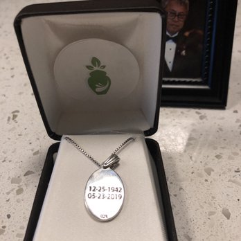 Cremation Green - Austin Funeral Home - The back of the thumbprint necklace engraved with his birthday and the last day he was alive. - Cremation Services Near Me - Austin, Texas Cremation Green - Austin Funeral Home - The back of the thumbprint necklace engraved with his birthday and the last day he was alive. - Cremation Services Near Me - Austin, Texas