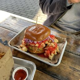 Hot Nashville topped w/ Mac & Cheese & flaming Cheeto dust
