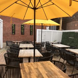 Sweet T & Greens - Big yellow market umbrellas cover the outside seating are , can't wait to come back on a sunny day