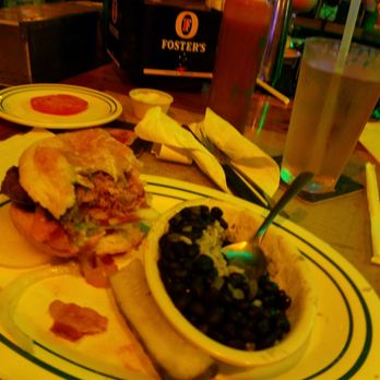 Flanigan's - Caribbean Burger with black beans and rice. - Seafood Near Me - Stuart, Florida