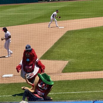 Reno Aces Baseball Club - Archie taking down a hot dog - Professional Sports Teams Near Me - Reno, Nevada