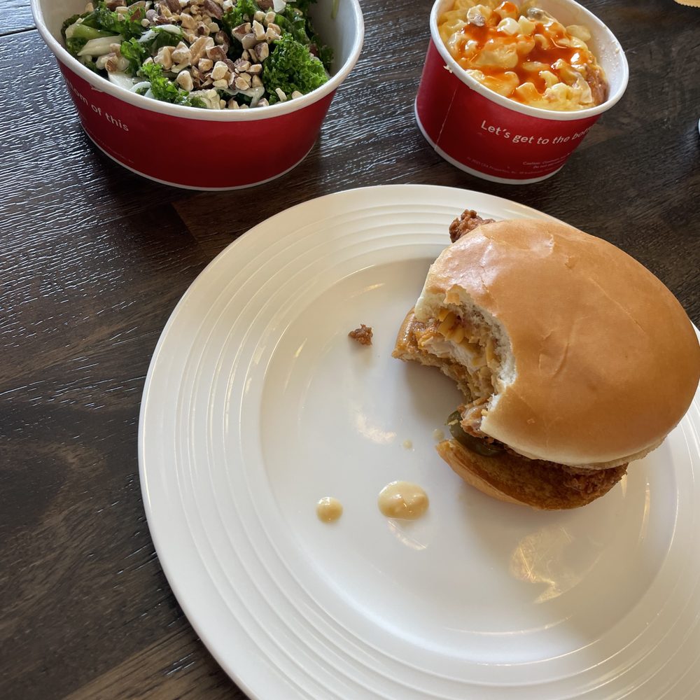 ows a plate of food and a bowl of salad