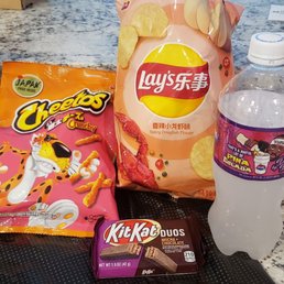 Metaiko cheetos, spicy crawfish chips, mocha and chocolate kit kat and pina colada drink