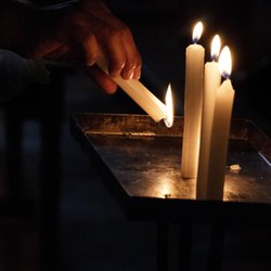 Chile Private Tours - Lighting candles in Church