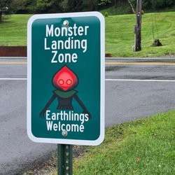 Flatwoods Monster Chairs - Flatwoods - Braxxie parking marker out front of Flatwoods police station and Chair.