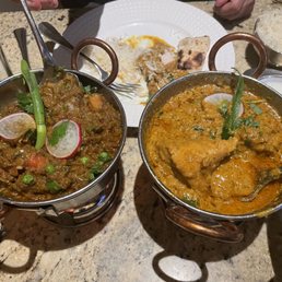 Baingan Bhartha on left and chicken on the bone korma on right Baingan Bhartha on left and chicken on the bone korma on right