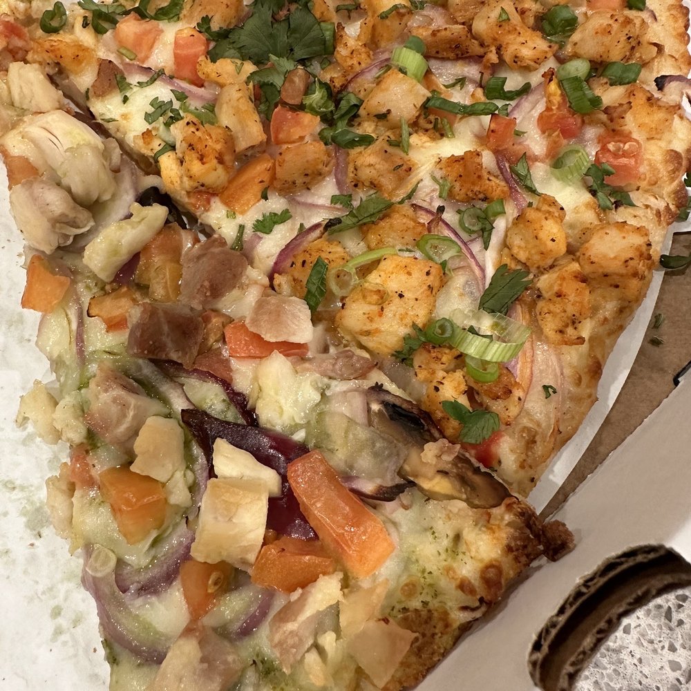 Curry Pizza House Manteca - Top: Chicken Tikka Bottom: Pesto Chicken - Pizza Near Me - Manteca, California