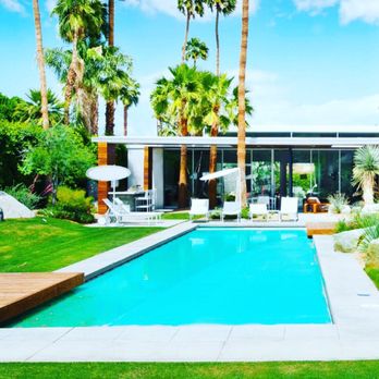Architectural Blue - a pool surrounded by palm trees - General Contractors Near Me Architectural Blue - a pool surrounded by palm trees - General Contractors Near Me