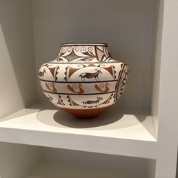 This pot had shattered into dozens of pieces. This picture is AFTER Marcos restored it.