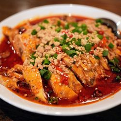 Tian Fu - Mouthwatering Chicken (重庆口水鸡): chicken leg quarters, topped with roasted peanuts, scallions, sesame seeds, sesame-peanut sauce ($16.99).
