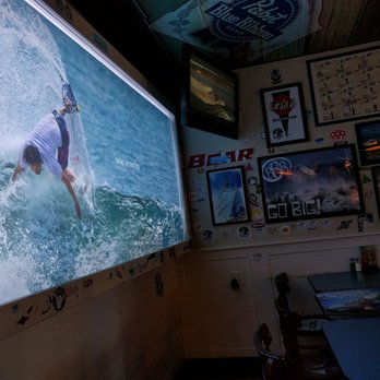 Wahoo's Fish Taco - Another TV! And a photo of Dane Reynolds - Seafood Near Me - Huntington Beach, California Wahoo's Fish Taco - Another TV! And a photo of Dane Reynolds - Seafood Near Me - Huntington Beach, California