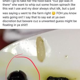 a spoon full of food with a black substance on it a spoon full of food with a black substance on it