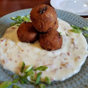 Neptune's Seafood Pub - Crab Cake tater tots.  Very nice presentation on all on the dishes. - Seafood Near Me - North Beach, Maryland
