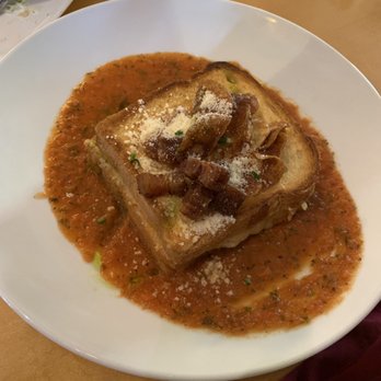 Mythos Restaurant - Open-faced grilled cheese in tomato bisque - New American Near Me - Orlando, Florida Mythos Restaurant - Open-faced grilled cheese in tomato bisque - New American Near Me - Orlando, Florida