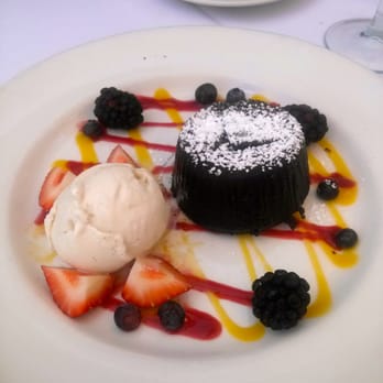 Varka Estiatorio - Chocolate lava cake with vanilla bean ice cream and fresh berries - Greek Near Me - Ramsey, New Jersey Varka Estiatorio - Chocolate lava cake with vanilla bean ice cream and fresh berries - Greek Near Me - Ramsey, New Jersey