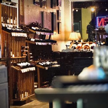 Uncorked - One of many bottle selection sections. - Wine Bars Near Me - Eustis, Florida