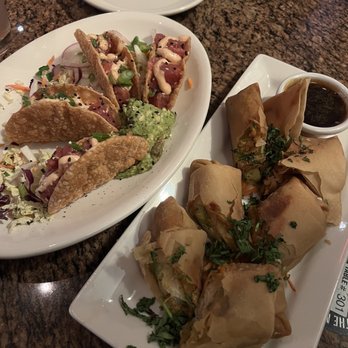 BJ's Restaurant & Brewhouse - Ahi Poke Tacos* and Avocado Egg Rolls - New American Near Me - Vienna, Virginia
