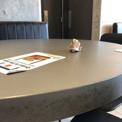 McDonald's - Table edge with ladies room door. At this point the management guy was in there working on the sink.