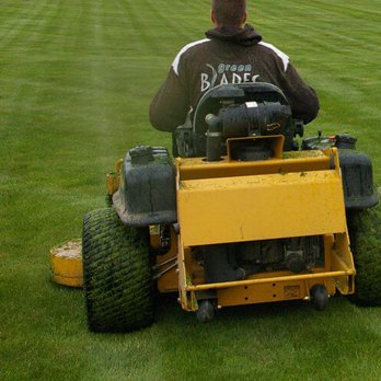 Green Blades Lawn Maintenance - a man riding a lawn mower - Landscaping Near Me - Nampa, Idaho Green Blades Lawn Maintenance - a man riding a lawn mower - Landscaping Near Me - Nampa, Idaho