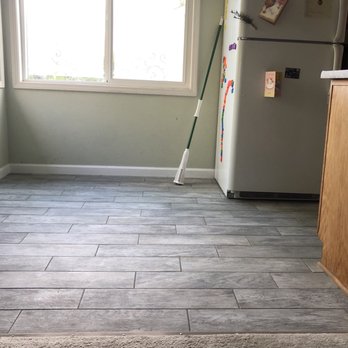 Rapid Restoration & Remodel - AFTER: porcelain tile floor with new baseboard - Damage Restoration Near Me - Clackamas, Oregon Rapid Restoration & Remodel - AFTER: porcelain tile floor with new baseboard - Damage Restoration Near Me - Clackamas, Oregon