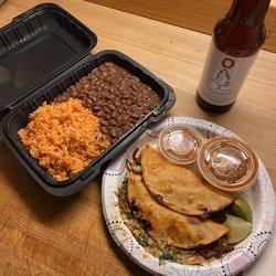 Taqueria El Coyote - Side of rice and beans, quesabirria with consume.
