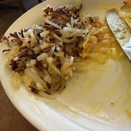 Burned and undercooked "hashbrowns" .