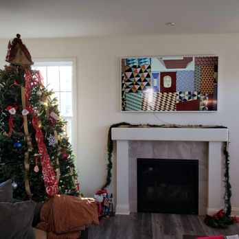 Bell Tech - Samsung frame TV above a fireplace. - Home Theatre Installation Near Me Bell Tech - Samsung frame TV above a fireplace. - Home Theatre Installation Near Me