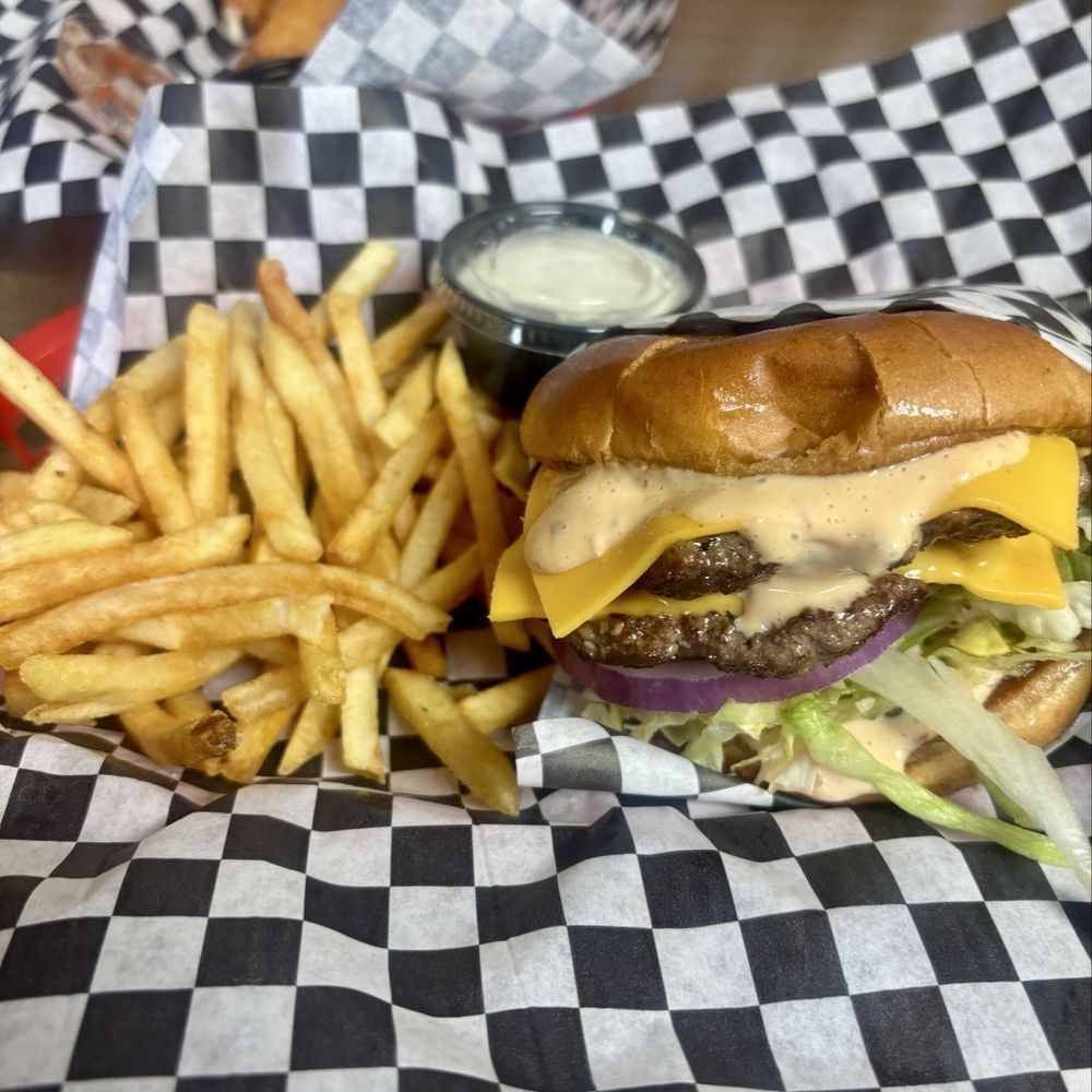 Roy's cheeseburger and fries. Roy's cheeseburger and fries.