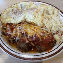 Carne Adovada (red chile), fried eggs and hash browns.