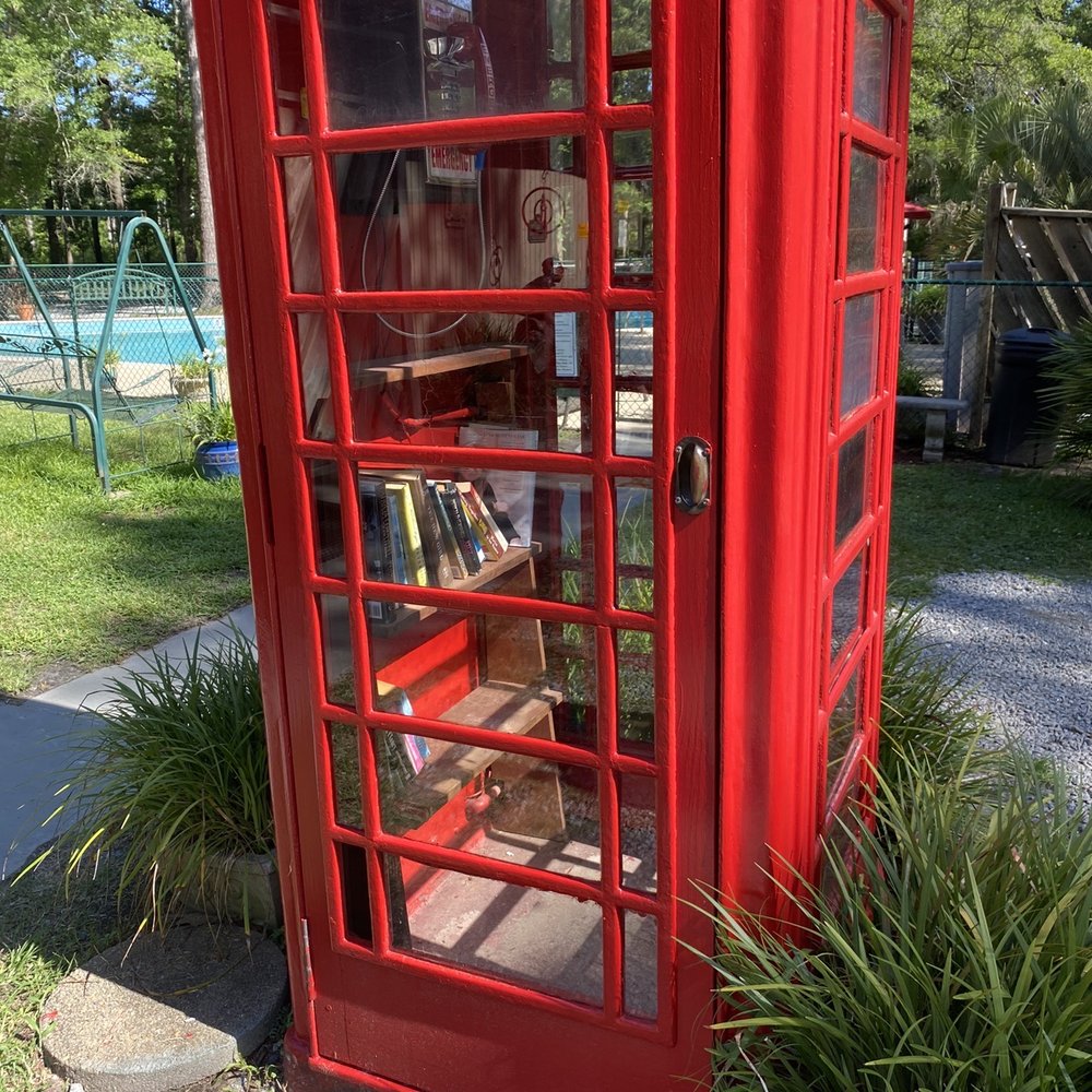 Telephone booth with a book exchange inside Telephone booth with a book exchange inside