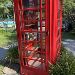 Telephone booth with a book exchange inside Telephone booth with a book exchange inside