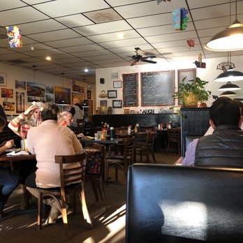 Cafe Java - Austin - Main area and about half full of customers. Fully staffed and good service - Coffee & Tea Near Me - Austin, Texas