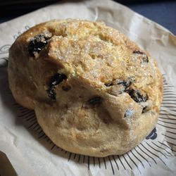 A scone with cherries.
