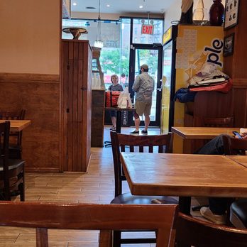 Mezze - a man sitting at a table in a restaurant - Mediterranean Near Me - Forest Hills, New York