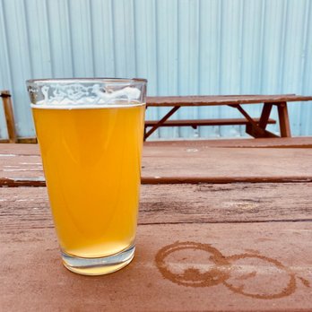 Defiance Brewing Co Taproom - a glass of beer on a picnic table - Breweries Near Me - Hays, Kansas Defiance Brewing Co Taproom - a glass of beer on a picnic table - Breweries Near Me - Hays, Kansas